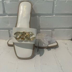 BNWT white sandals with gold chain detail. Size 9